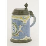 A tin-glazed earthenware tankard,late 18th century, probably German, with a powder blue ground