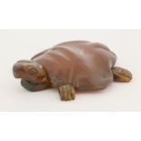 An amber turtle,17th century, possibly German, the carved body with applied head and feet,8.5cm