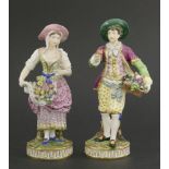 A pair of Minton figures,of a fruit seller and a flower seller,19cm high (2)