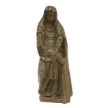 A French carved walnut figure of St. Anne,16th century, the robed figure posed in solemn reverence,