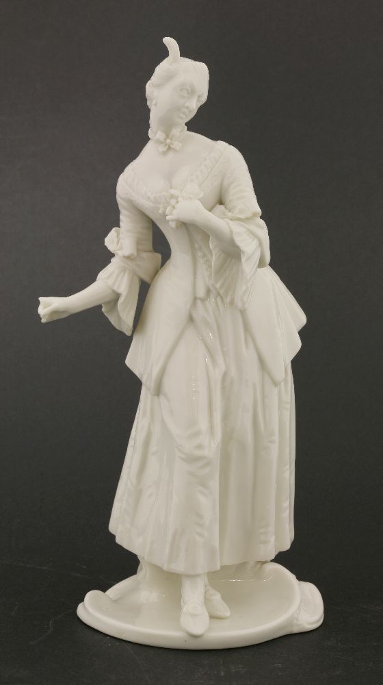 A Komodie white porcelain figure,‘Isabella’, mounted on shaped oval base, with impressed mark and