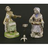 Two Meissen monkey band figures of singers,13 and 14cm high,plus music stand,7cm high (3)
