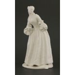 A Komodie white porcelain figure,‘Lucinda’, mounted on shaped oval base, with impressed mark,20cm