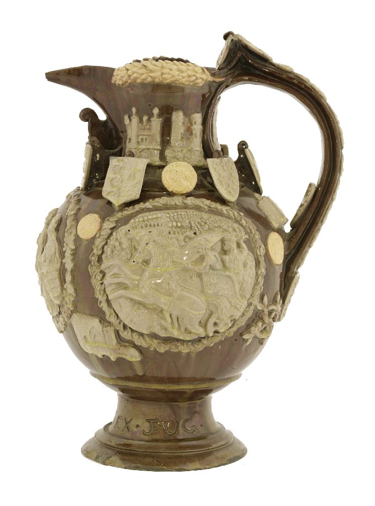 A Castle Hedingham pottery 'The Essex Jug',dated 1890, applied with three panels, arms and roundels,