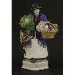 A Burslem pottery figure of a greengrocer,
