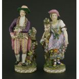 A pair of Minton figures,of a gardener and his female companion, the young man dressed in