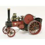 A live steam model of a William Allchin traction engine,in burgundy livery,35cm long