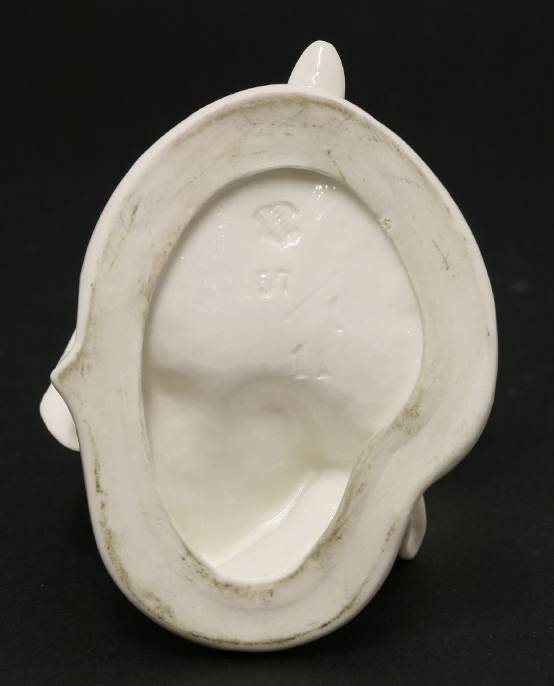 A Komodie white porcelain figure,of Pantalone leaning forward on a shaped circular base, with - Image 3 of 3