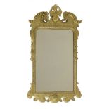 A George II-style giltwood wall mirror,with carved decoration and bevelled plate,123cm high