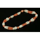 A four-row, two-colour, twig coral necklace, c.1830,with sections of white and salmon interlocking