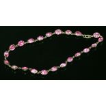 A Georgian silver, pink paste set rivière, c.1800-1820,the necklace composed of a series of