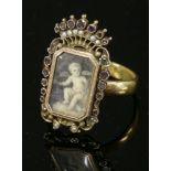 A Georgian two-colour gold gem set painted miniature,later mounted to a 22ct gold wedding ring. A