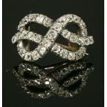 A Georgian, diamond set, figure of eight knot brooch,of slightly arched from, with a line of