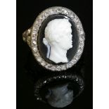 An hardstone cameo and diamond ring,with the bust of a gentleman in white to a black ground. A