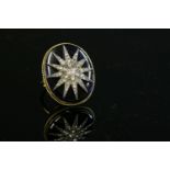 A Victorian diamond set India star and blue glass plaque,later mounted as a ring. An oval, domed,