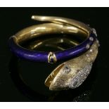 A Victorian diamond and enamel articulated snake bangle,hollow elliptical section with the body