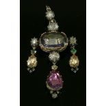 A gem set girandole pendant/brooch,with a central foil-backed oval mixed cut iolite, in a domed back