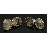 A pair of Georgian gold and silver moss agate cufflinks,with each oval moss agate tablet rub set