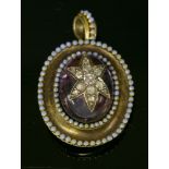 A Victorian gold, amethyst, diamond and enamel pendant, c.1860,with an oval cabochon amethyst with