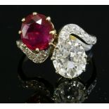 A two stone untreated Burma ruby and diamond crossover ring,with diamond set shoulders. A slightly