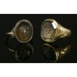 A gentlemen's smokey quartz intaglio ring,with an octagonal smokey quartz intaglio engraved with the