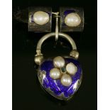 A Victorian silver and gold, emerald, split pearl and enamel locket/centrepiece,a pair of