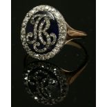 A Georgian enamel and diamond set oval monogram ring,with rose cut diamond set monogram, possibly '