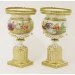 A pair of porcelain urns, both gilt decorated and painted with chickens and turkeys, with landscapes