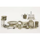 A silver tea caddy, three napkin rings, a heart shaped toast rack, a shovel, a pair of tongs, a