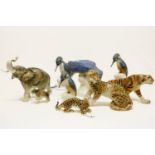 A quantity of Royal Dux porcelain animals, to include a large blue macaw, three kingfishers, a