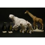 A quantity of Royal Dux porcelain animals, to include a large polar bear, together with a giraffe, a