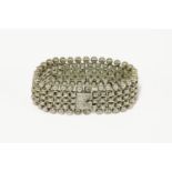 A Victorian silver bracelet, with applied star plaque and a ball fringe to either side45.22g