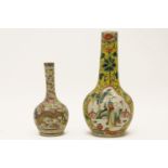 Two Chinese bottle vases, the tallest with two reserved figural panels and polychrome decoration on