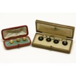 A cased set of four Art Deco black onyx button dress studs, with rose cut diamond stitch detail to