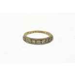 A diamond set half eternity ring, hand engraved description to the inside of the shank (indistinctly