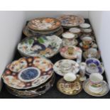 A collection of ceramic plates and tea wares, to include two Royal Crown Derby Imari patterned