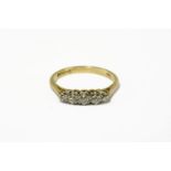 An 18ct gold five stone graduated diamond ring, with graduated old European and old eight cut