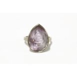 An 18ct white gold single stone pear shaped amethyst ring