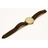 A gentleman's gold plated Girard Perregaux automatic strap watch,cream dial with gold baton and