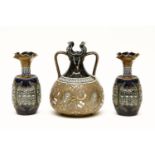 A stoneware Doulton Lambeth twin handled vase, and a pair of small stoneware Doulton Lambeth vases