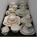 A quantity of Shelley porcelain tea wares, to include seven trios and additional plates and jugs and