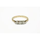 A gold three stone diamond ring (marked indistinctly 18ct and plat)2.12g