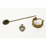 A gold single stone moss agate cabochon stick pin (tested as 9ct gold), a gold diamond heart