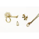 A gold Mikimoto graduated cultured pearl cluster ribbon brooch marked 14k, a single stone cultured