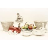 A collection of blanc de Chine ceramics,two baskets, a pink teapot, fruit in a basket, dishes,