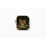 A single stone smokey quartz gold ring, ignole markings, (tested as approximately 9ct gold),