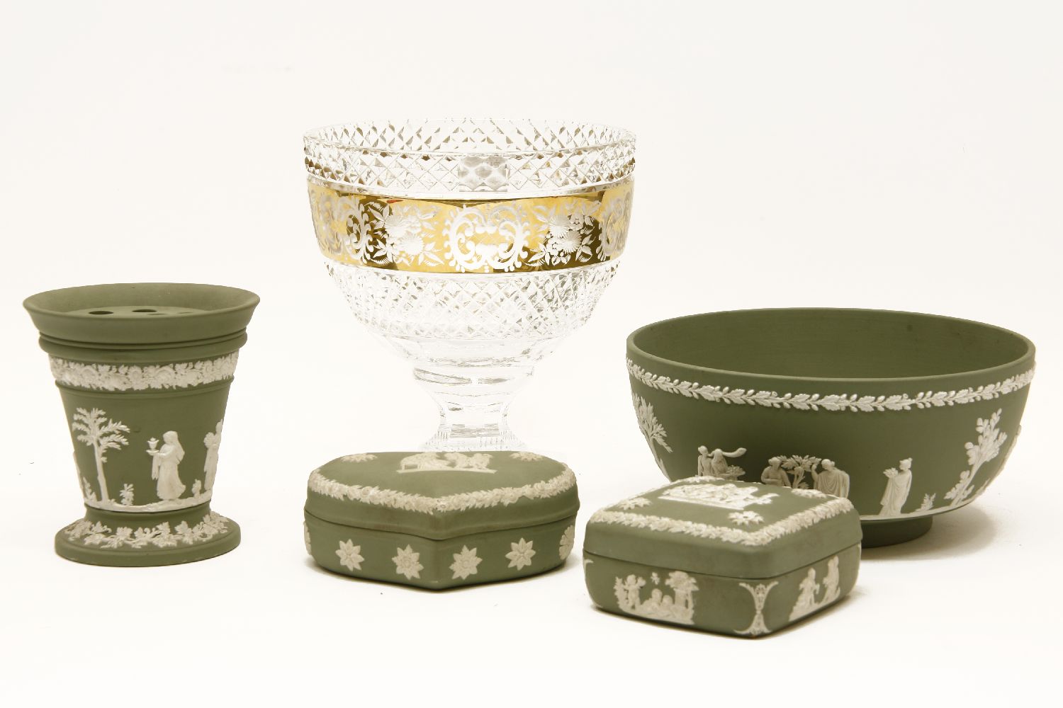 A collection of Wedgwood sage green jasperware, to include a footed bowl, vase, and two trinket
