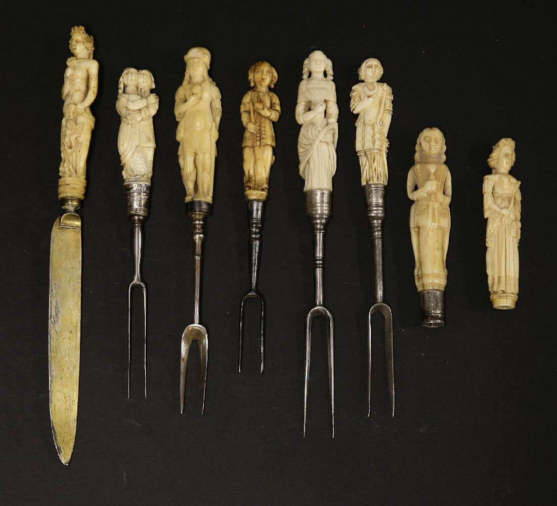 Eight carved ivory figural cutlery handles,early 17th century, five with two-pronged forks, one a