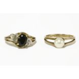 A 9ct gold single stone sapphire ring with diamond set shoulders, and a 9ct gold single stone