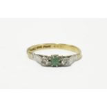 A gold emerald and diamond three stone ring, marked 18ct and plat2.19g